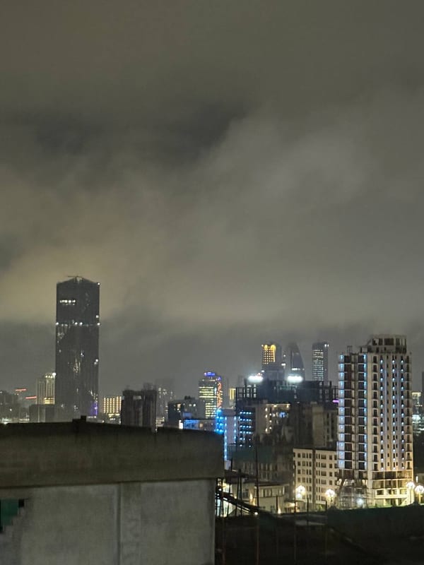 The skyline at night under low cloud