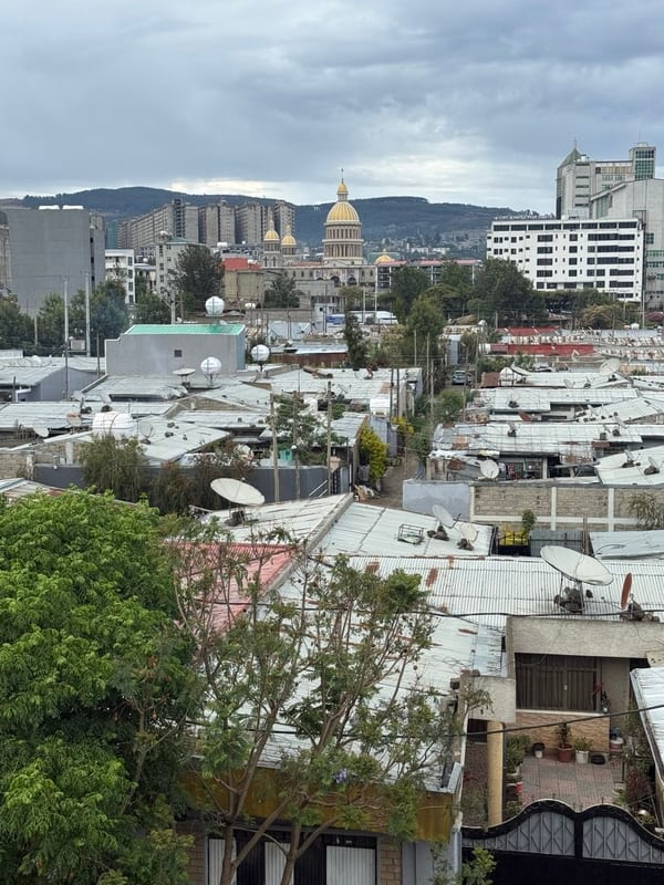 Rooftops of the city, a gold dome in the distance