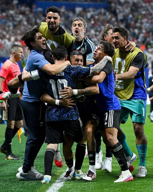 Argentina players piling into a celebration