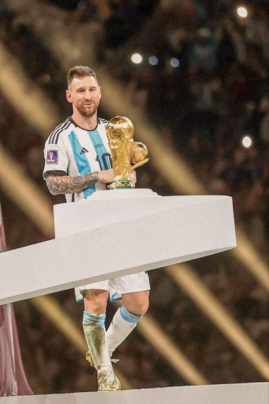 Lionel Messi holding the World Cup trophy