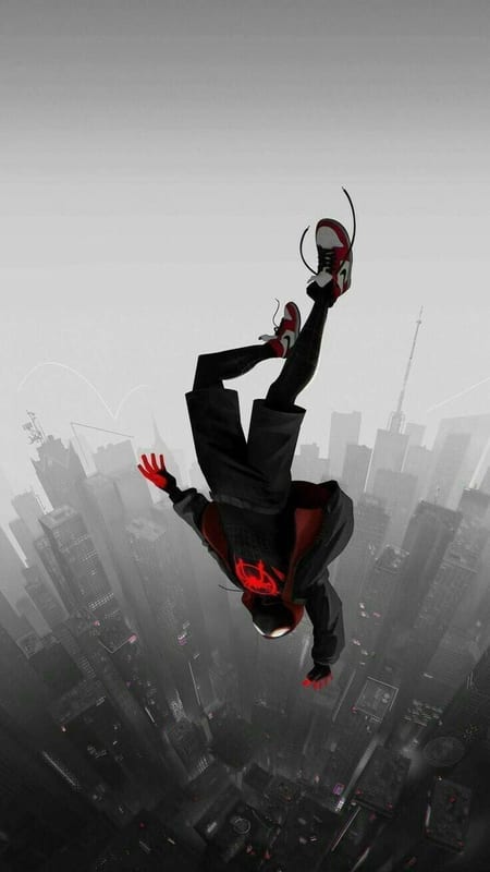 Miles Morales falling headfirst over a grey city