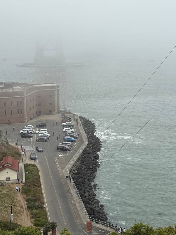 Fort Point and the water from above, in fog