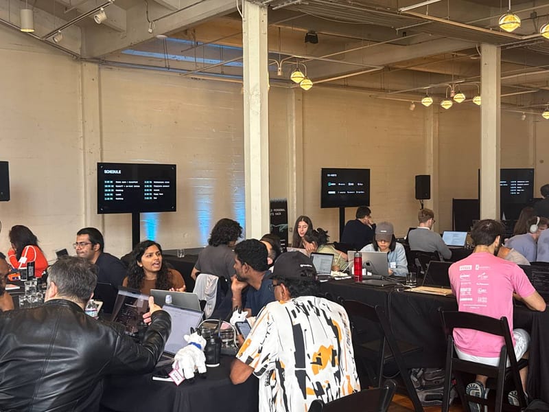 Hackathon tables, laptops open