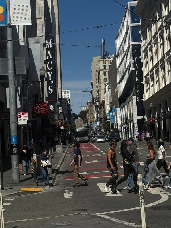 People crossing by Macy's