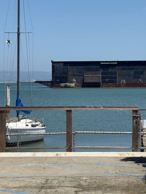 A sailboat moored by a railing
